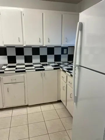 a kitchen with appliances cabinets and a sink