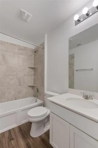 an empty room with a fan