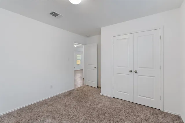 a view of balcony with wooden floor
