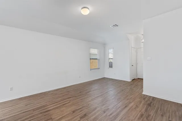 a kitchen with kitchen island a sink appliances and cabinets