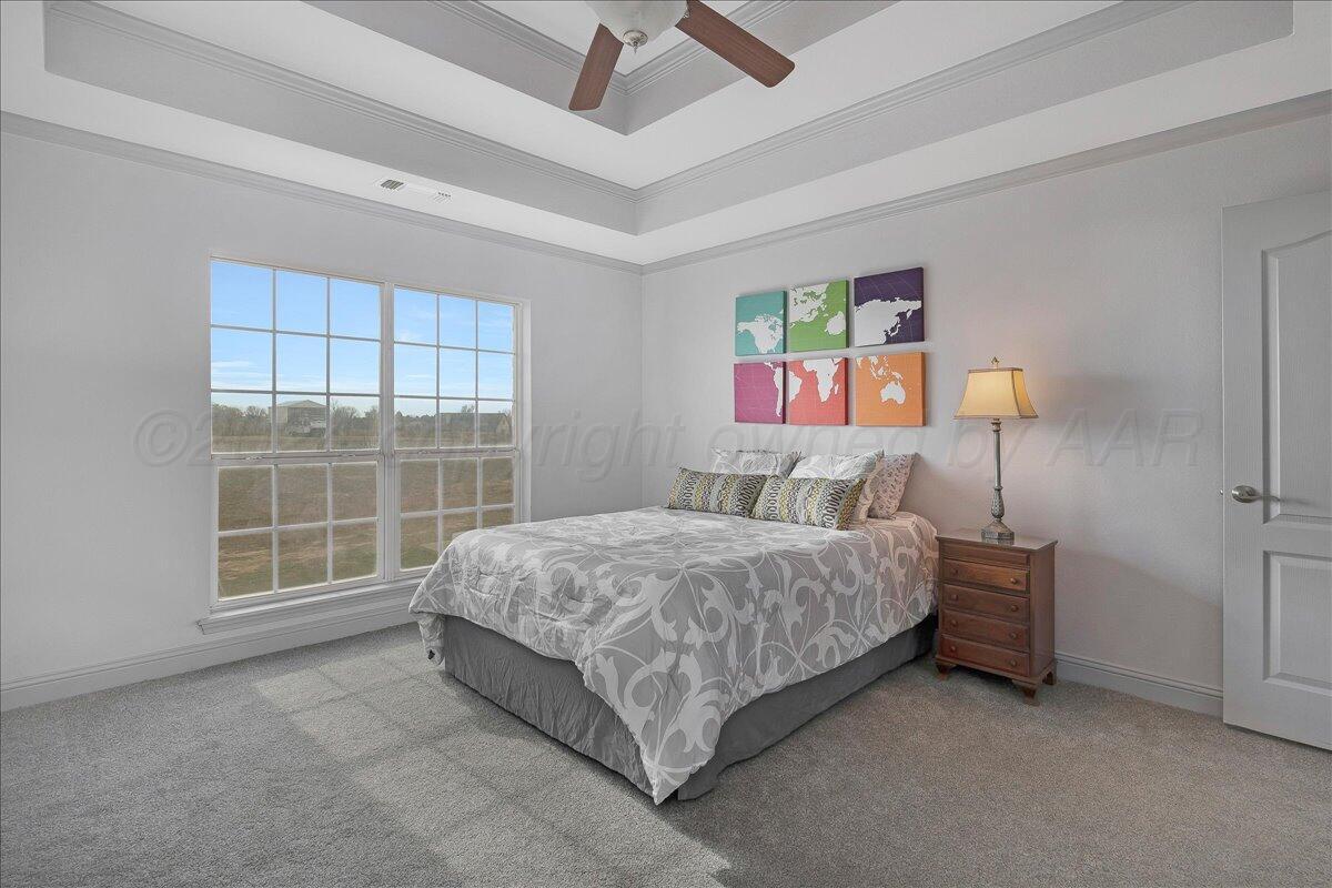 8501 Bryeson Lane Canyon, TX 79015 - Photo 14 of 25 a bed room with a bed and a window