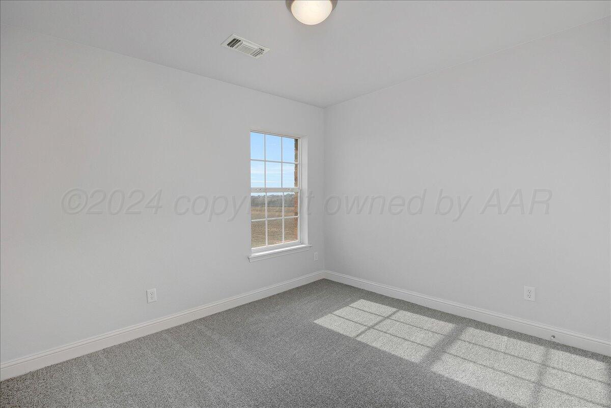 8501 Bryeson Lane Canyon, TX 79015 - Photo 18 of 25 an empty room with a window