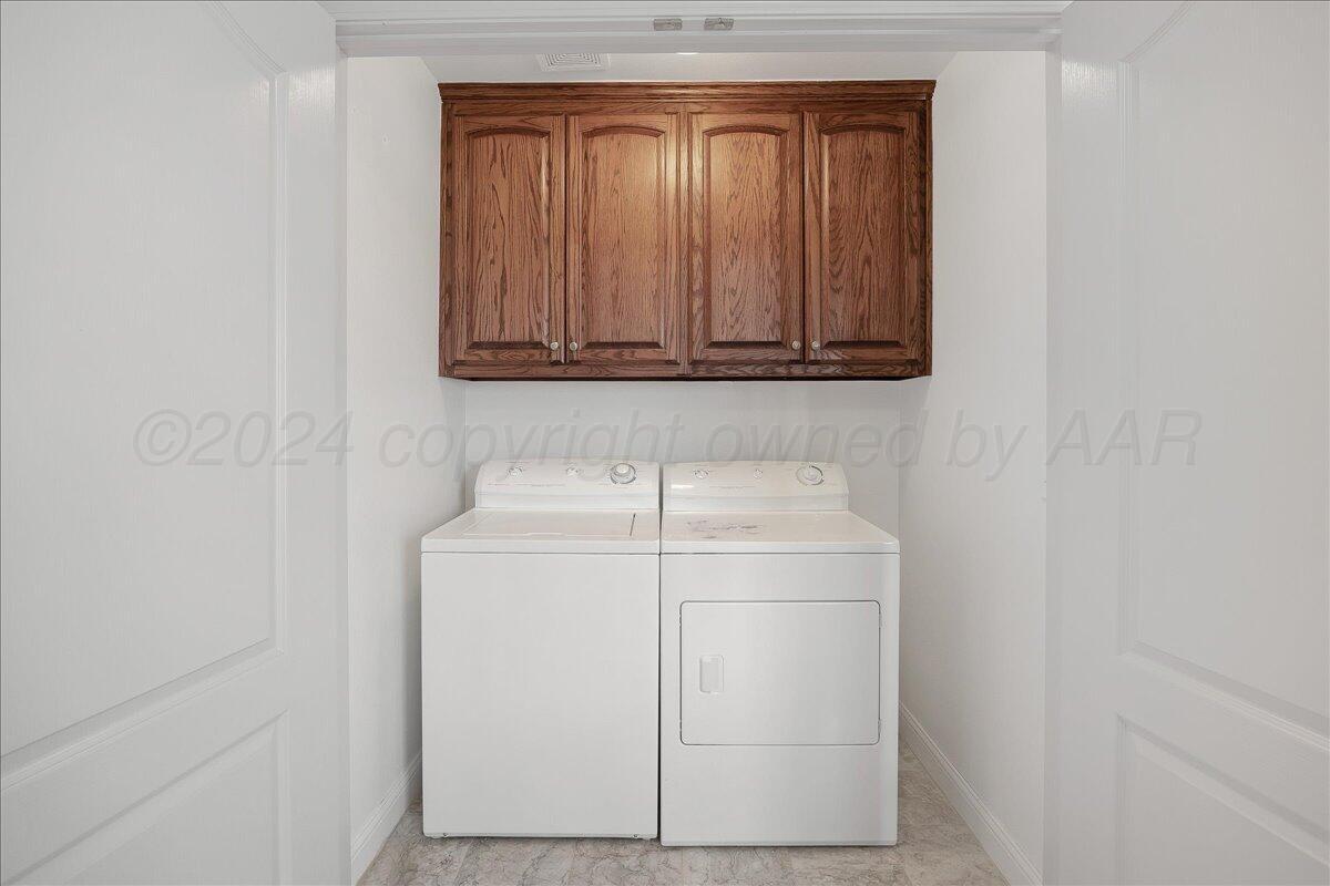 8501 Bryeson Lane Canyon, TX 79015 - Photo 22 of 25 a utility room with dryer and washer