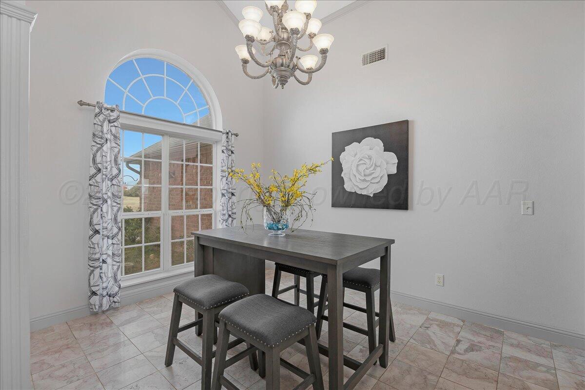 8501 Bryeson Lane Canyon, TX 79015 - Photo 5 of 25 a view of a dining room with furniture and a chandelier