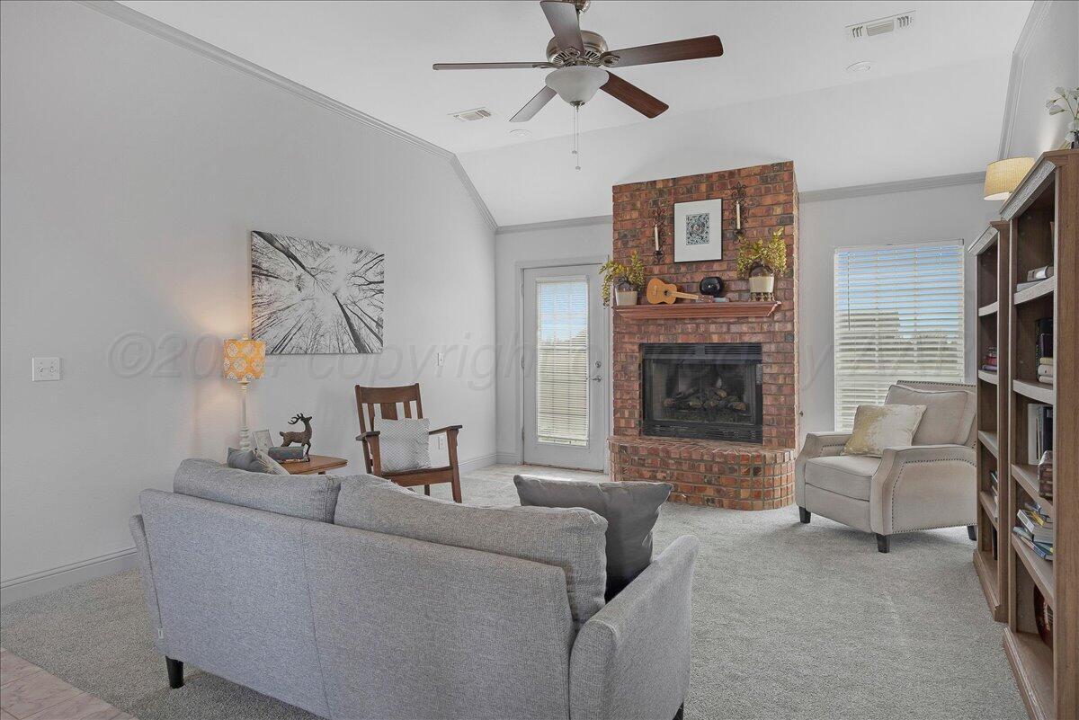 8501 Bryeson Lane Canyon, TX 79015 - Photo 7 of 25 a living room with furniture and a fireplace