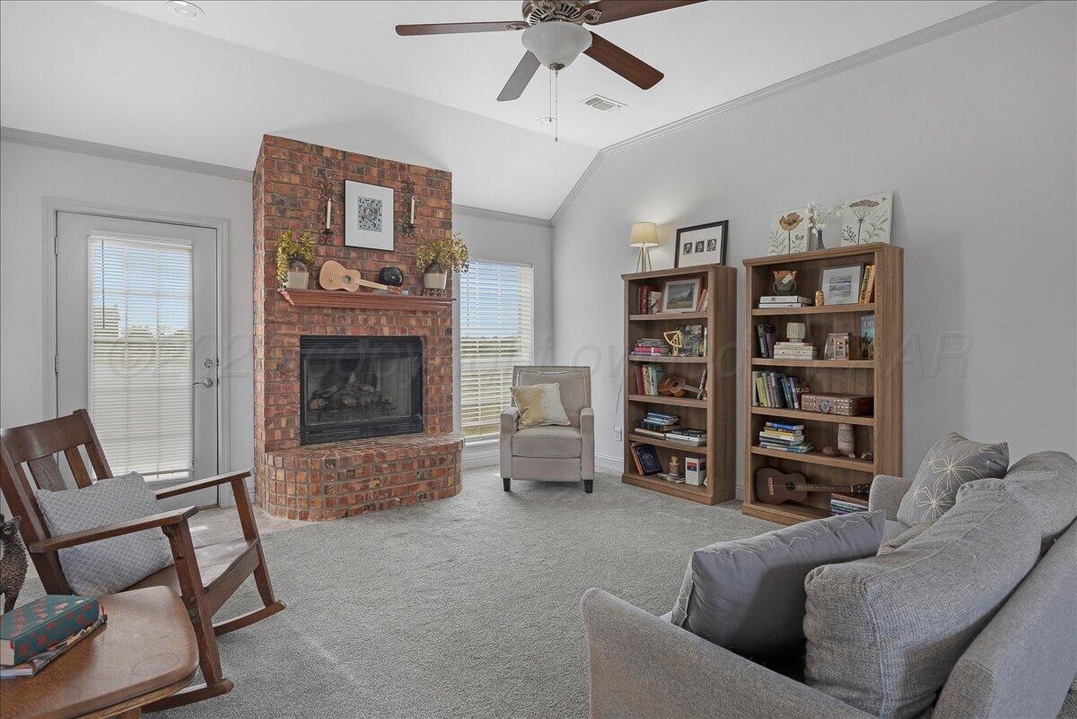 8501 Bryeson Lane Canyon, TX 79015 - Photo 8 of 25 a living room with furniture and a fireplace