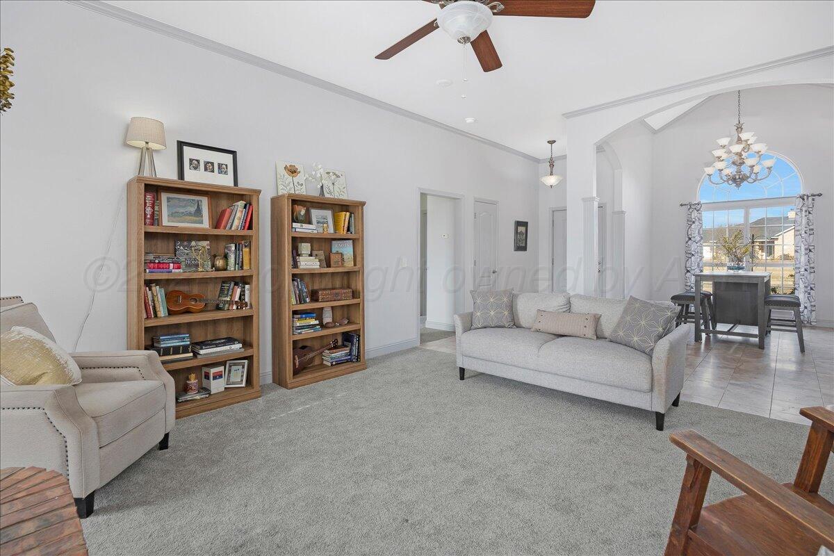 8501 Bryeson Lane Canyon, TX 79015 - Photo 9 of 25 a living room with furniture and a book shelf