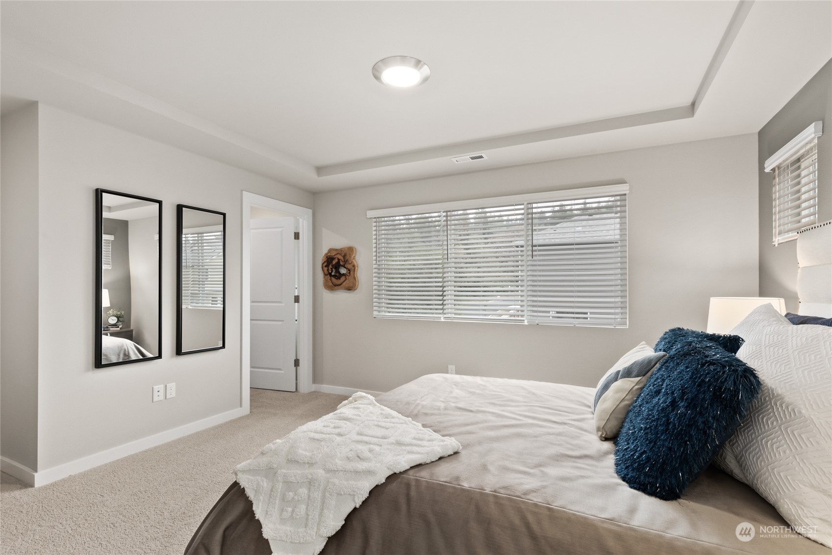 20801 3rd Drive Southeast Bothell, WA 98012 - Photo 4 of 34 a bed sitting in a bedroom next to a window and a chair