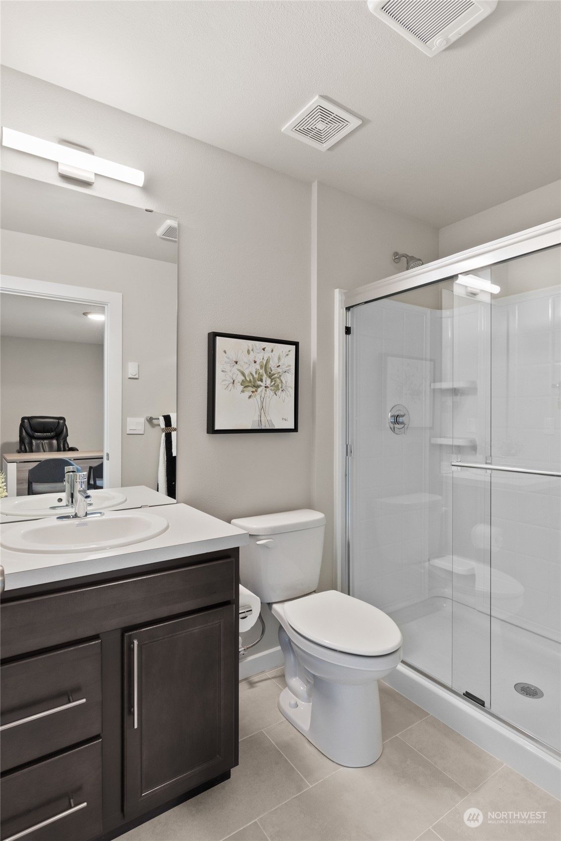 20801 3rd Drive Southeast Bothell, WA 98012 - Photo 9 of 34 a bathroom with a toilet a sink a mirror and shower