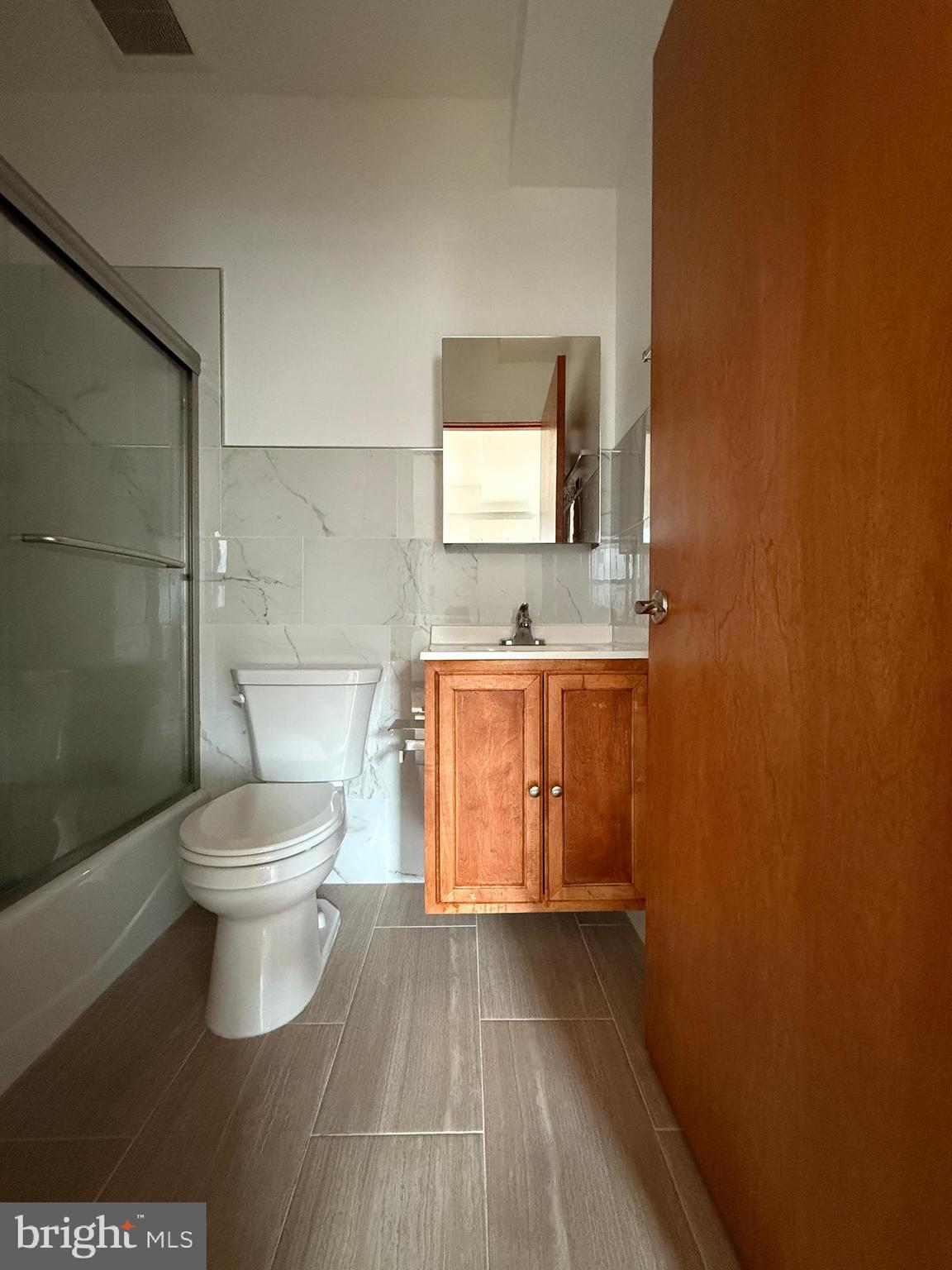 146 North 10th Street, Unit 3B Philadelphia, PA 19107 - Photo 3 of 8 a bathroom with a toilet and a sink