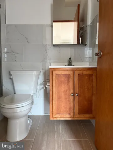 a bathroom with a toilet and a sink