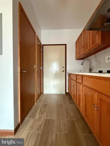 a view of a kitchen with a sink