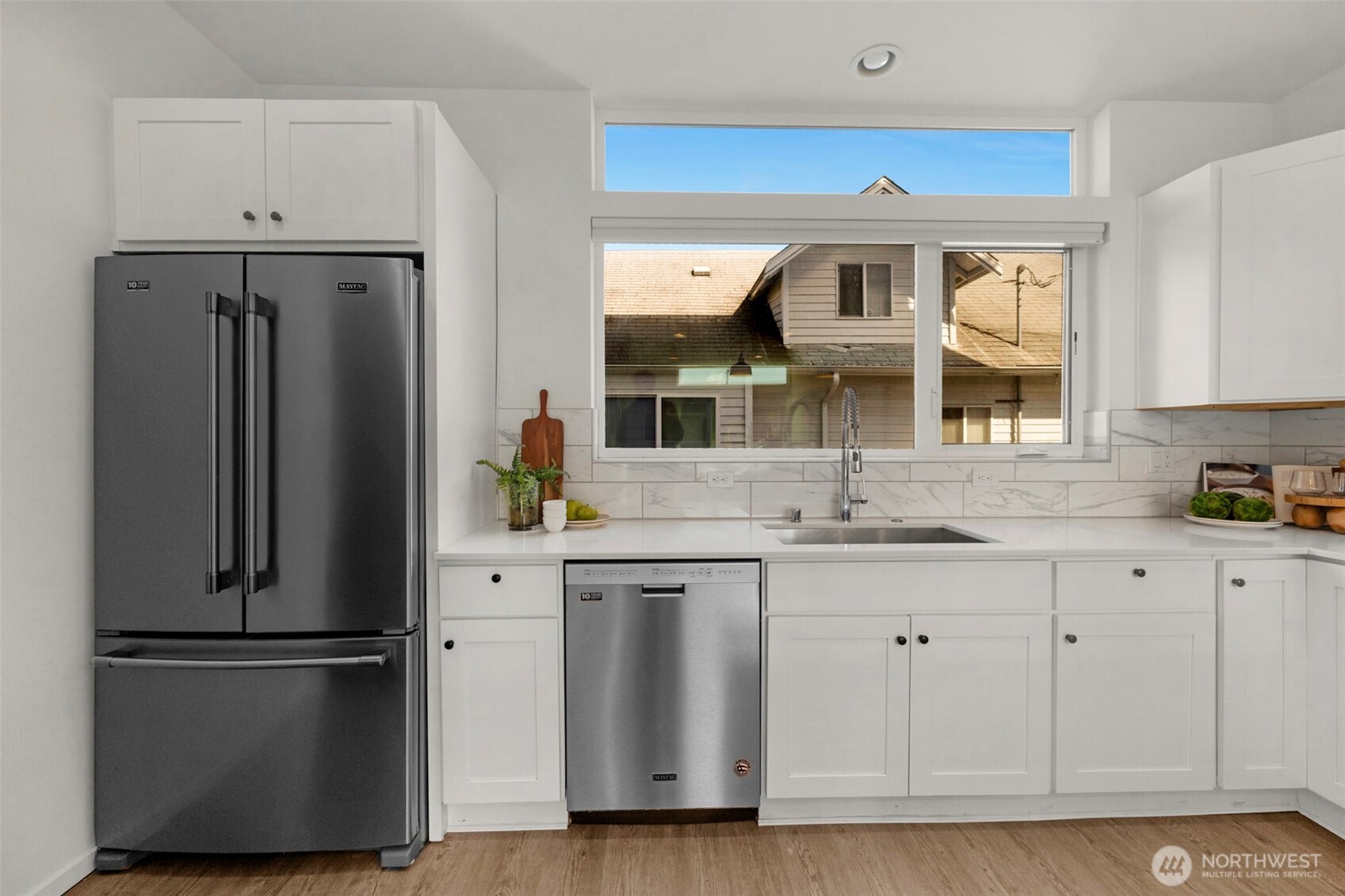 1966 South Grand Street Seattle, WA 98144 - Photo 11 of 25 a kitchen with stainless steel appliances a refrigerator and a sink