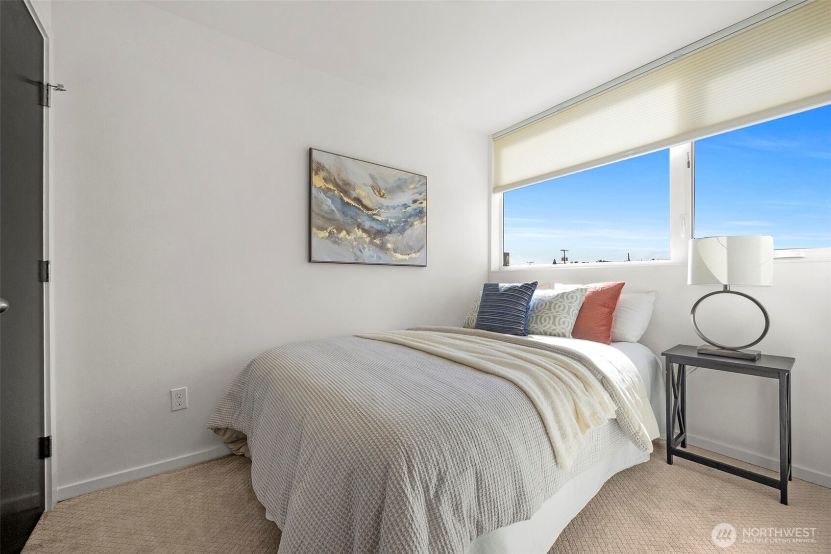1966 South Grand Street Seattle, WA 98144 - Photo 15 of 25 a bedroom with a bed and a painting on the wall