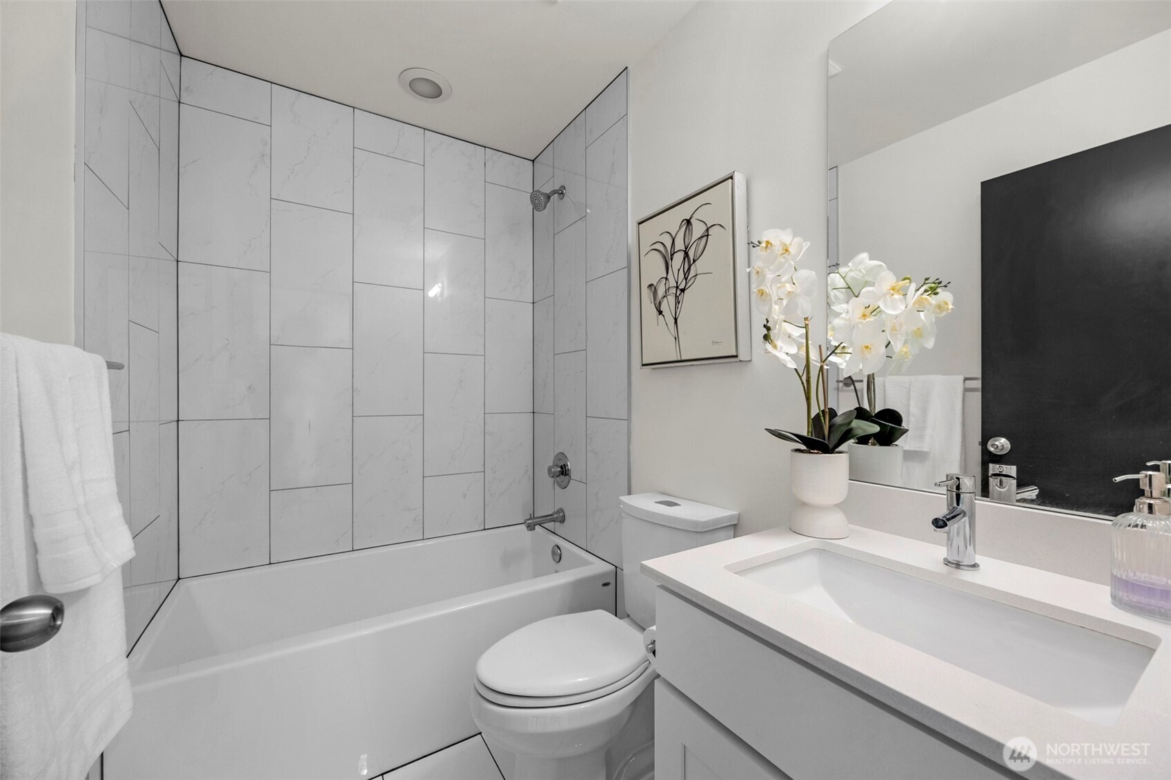 1966 South Grand Street Seattle, WA 98144 - Photo 17 of 25 a bathroom with a sink a toilet and a large mirror