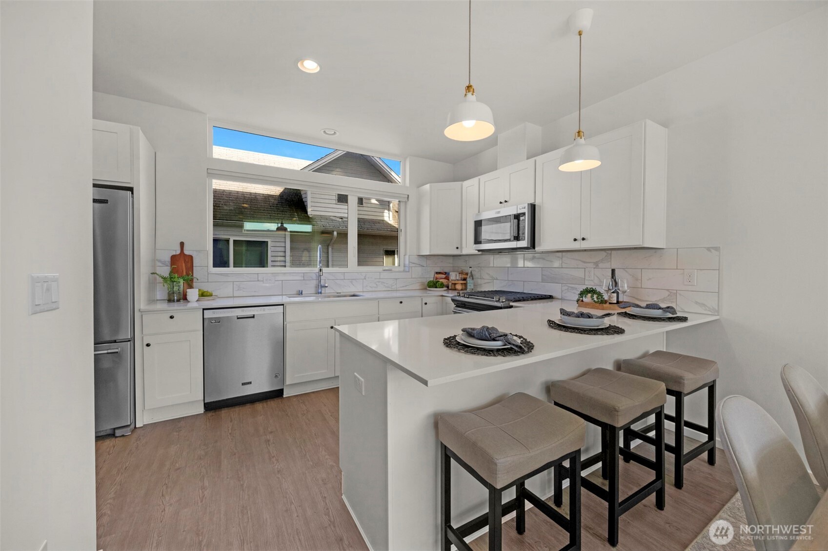 1966 South Grand Street Seattle, WA 98144 - Photo 8 of 25 a kitchen with a sink stove and cabinets