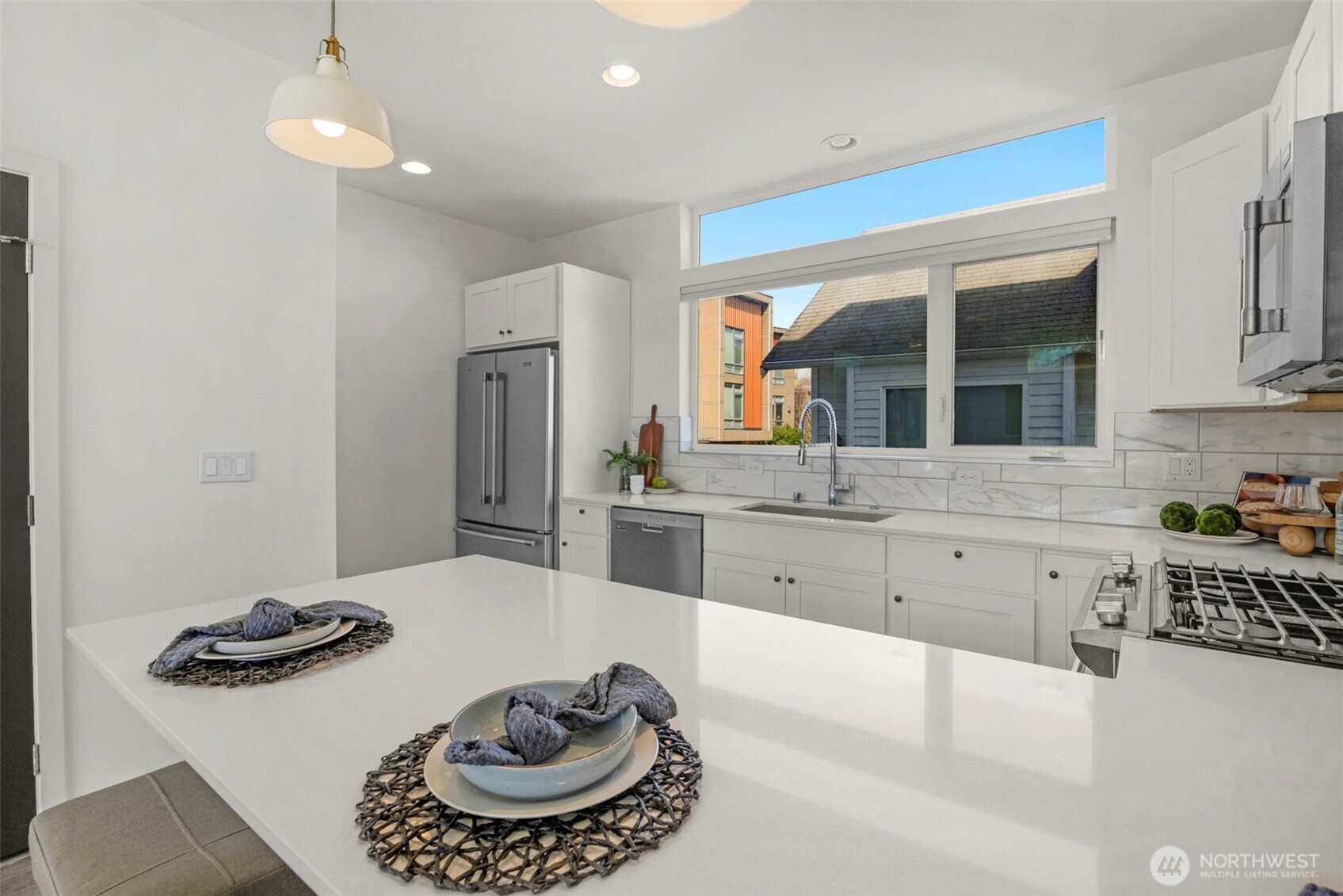 1966 South Grand Street Seattle, WA 98144 - Photo 9 of 25 a kitchen with a refrigerator and a stove