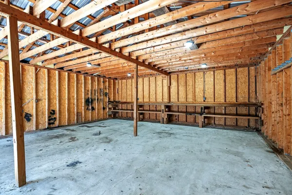 a view of an empty room with wooden walls