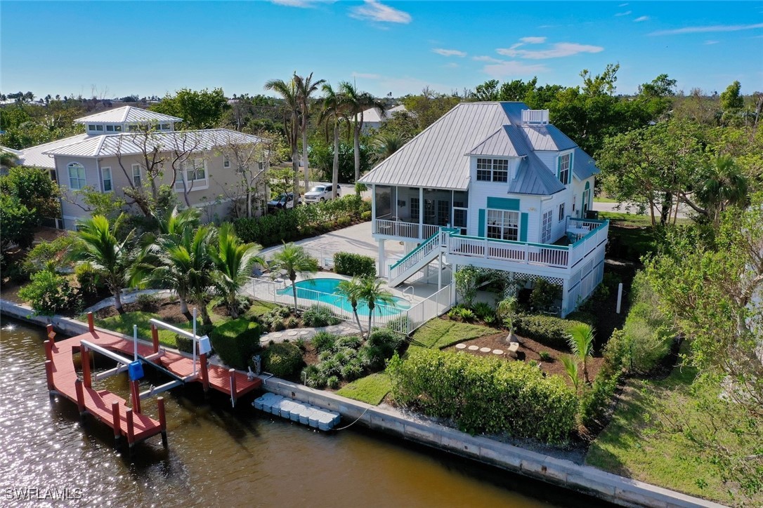 862 Beach Road Sanibel, FL 33957 - Photo 1 of 49 an aerial view of a house with garden space and street view