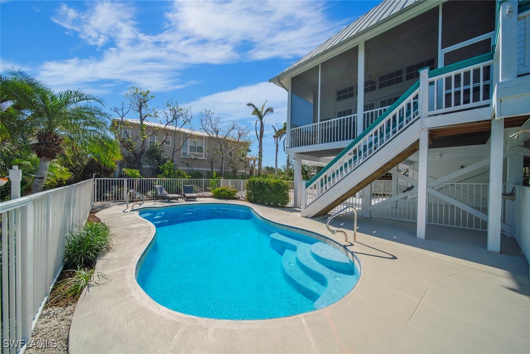 862 Beach Road Sanibel, FL 33957 - Photo 12 of 49 a view of a house with pool and wooden stairs