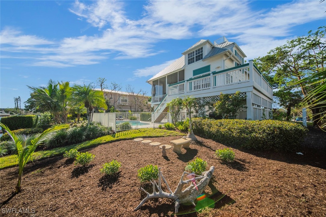 862 Beach Road Sanibel, FL 33957 - Photo 2 of 49 a view of a house with a yard