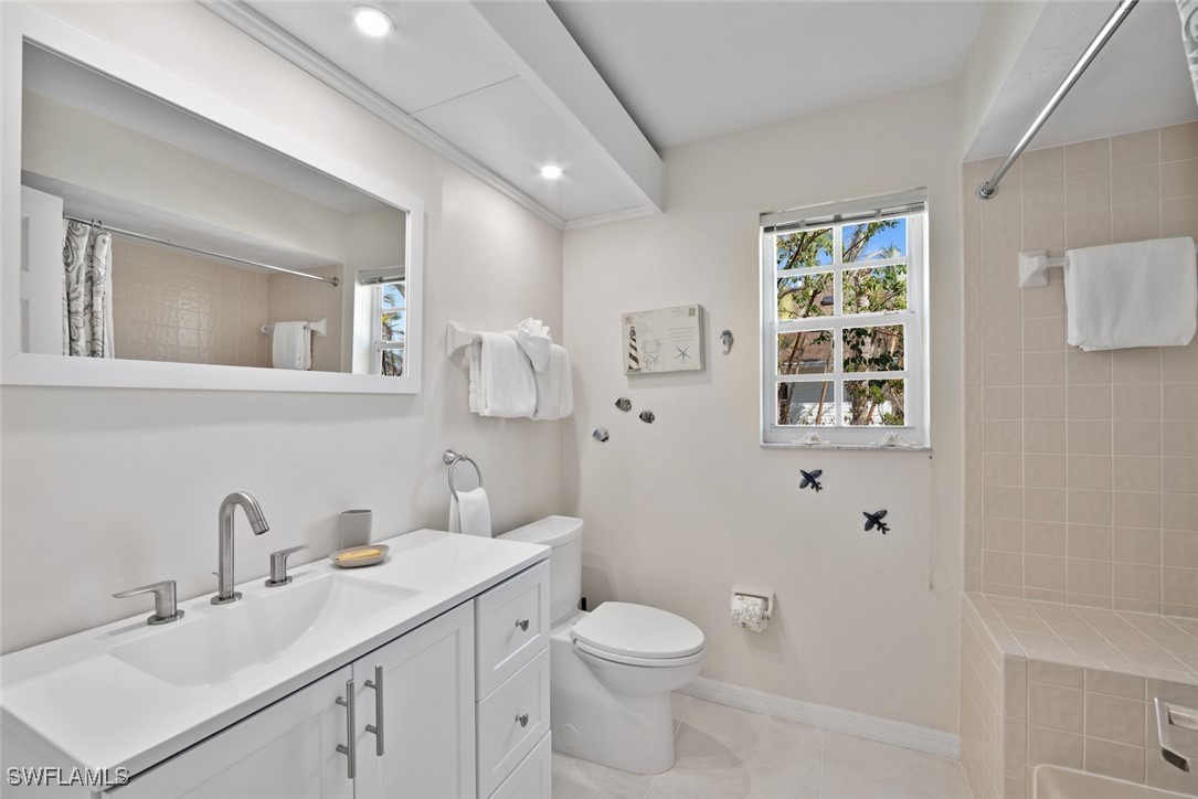 862 Beach Road Sanibel, FL 33957 - Photo 29 of 49 a bathroom with a toilet sink and mirror