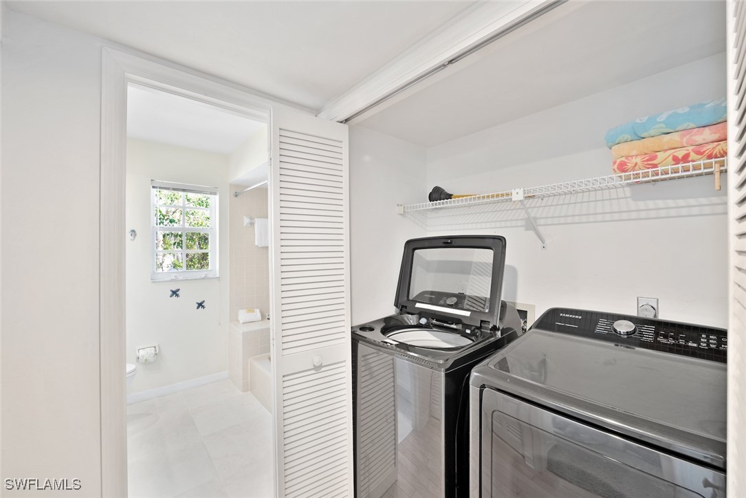 862 Beach Road Sanibel, FL 33957 - Photo 30 of 49 a utility room with closet dryer and washer