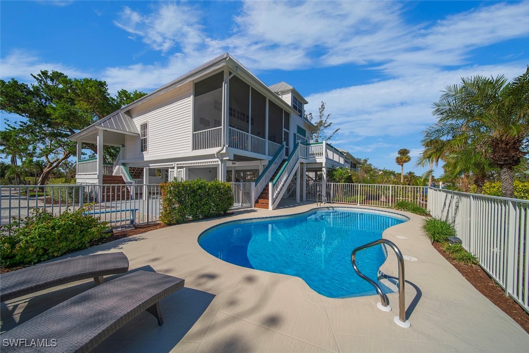 862 Beach Road Sanibel, FL 33957 - Photo 3 of 49 a view of a swimming pool with a patio