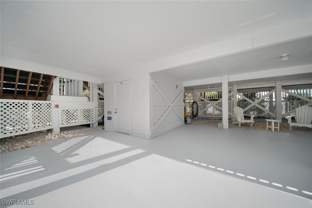 862 Beach Road Sanibel, FL 33957 - Photo 33 of 49 a bedroom with a bed and white walls