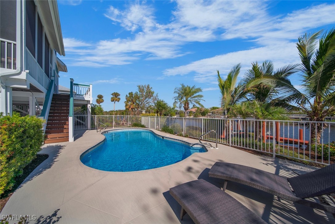 862 Beach Road Sanibel, FL 33957 - Photo 35 of 49 a view of a swimming pool with a deck