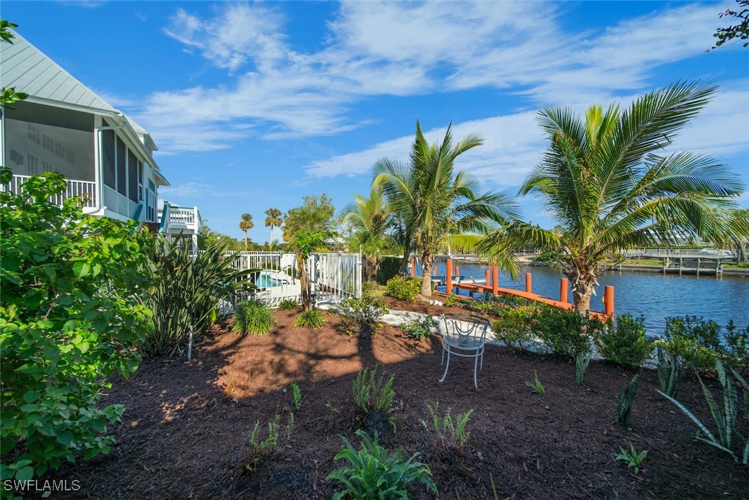 862 Beach Road Sanibel, FL 33957 - Photo 40 of 49 a view of a backyard with plants and a patio