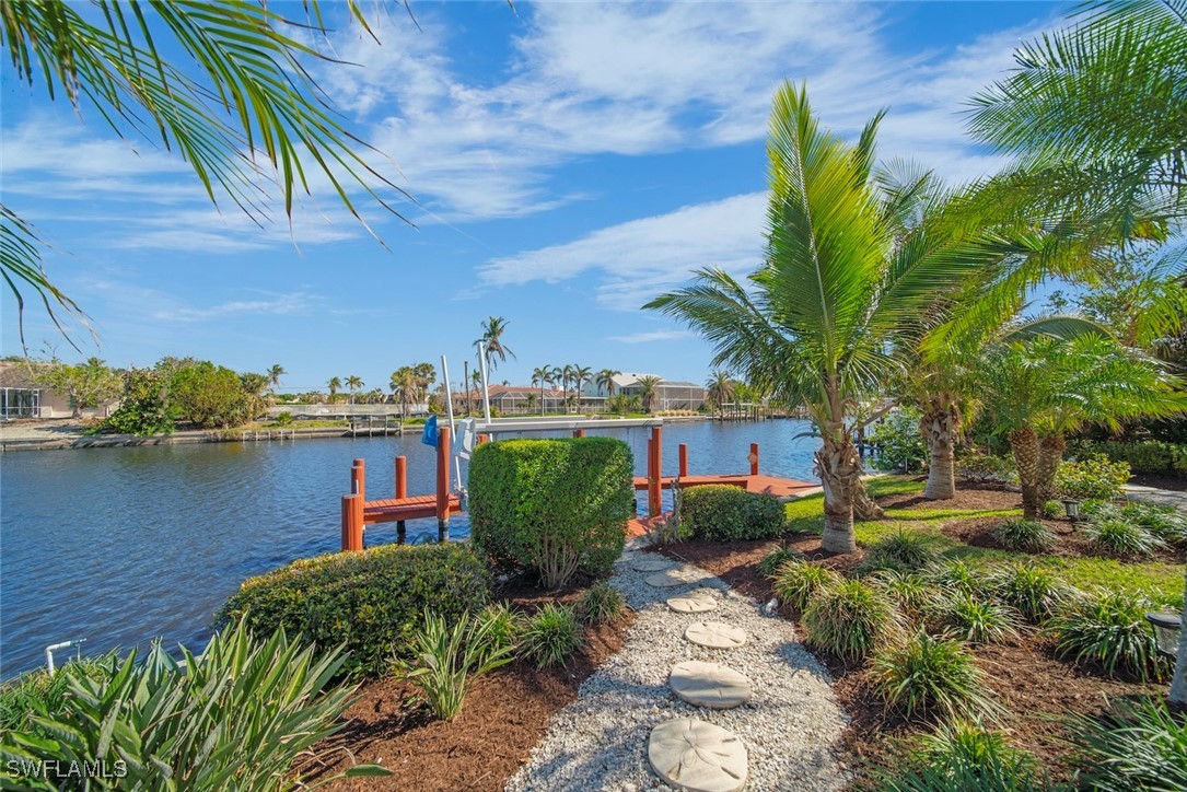 862 Beach Road Sanibel, FL 33957 - Photo 41 of 49 a view of a lake with a yard and plants