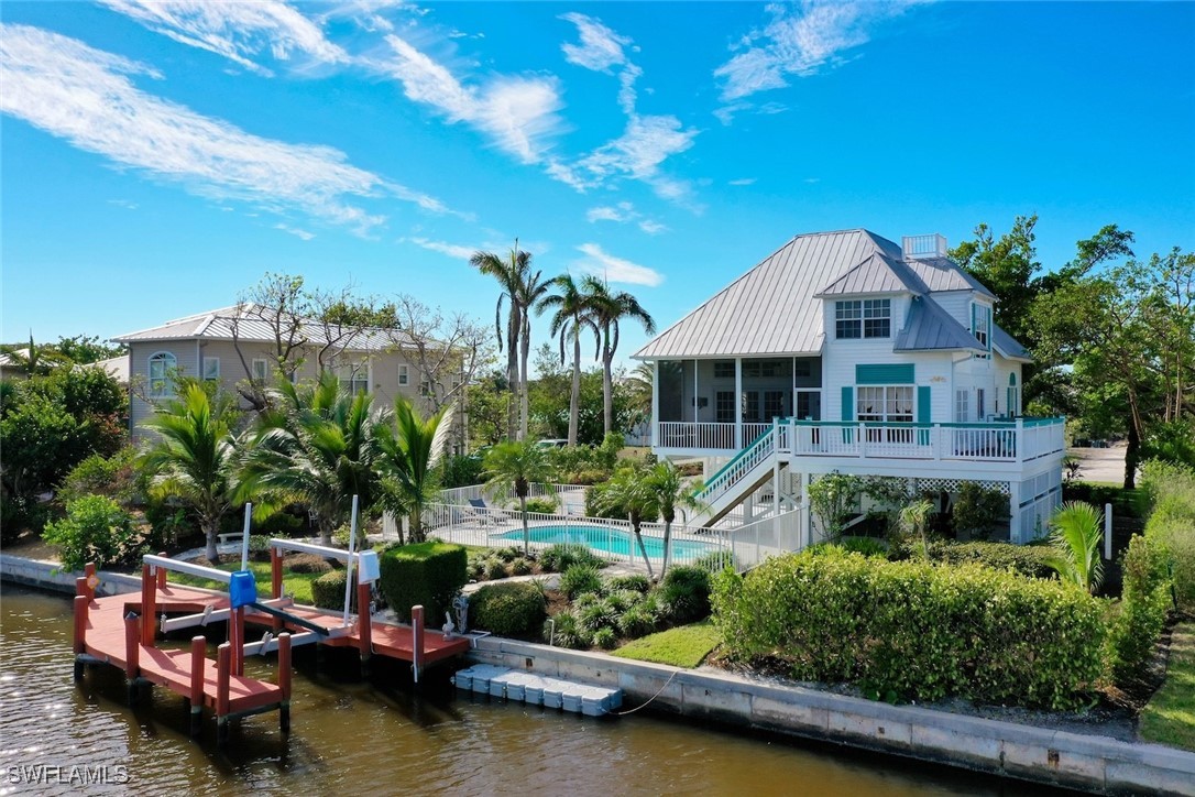 862 Beach Road Sanibel, FL 33957 - Photo 45 of 49 a front view of house with yard and outdoor seating