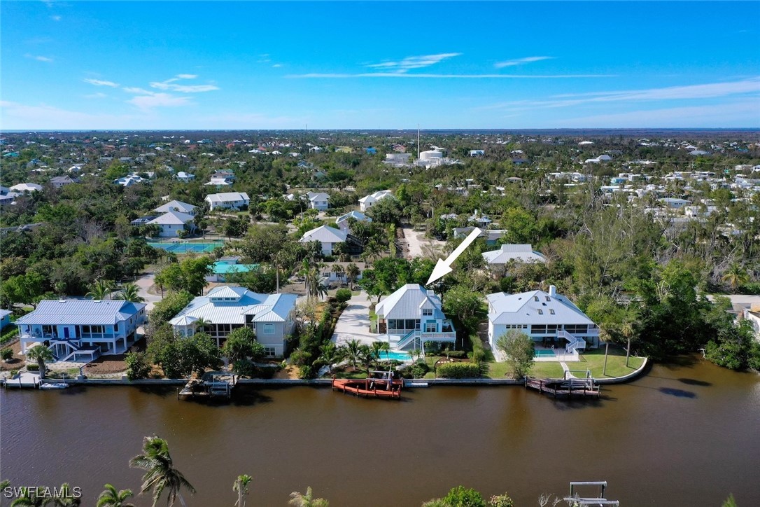 862 Beach Road Sanibel, FL 33957 - Photo 46 of 49 an aerial view of residential house with outdoor space and lake view