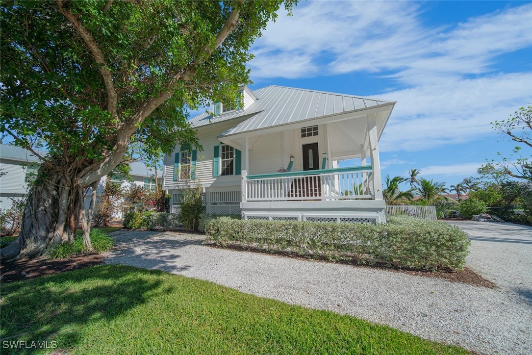 862 Beach Road Sanibel, FL 33957 - Photo 5 of 49 a front view of a house with a yard
