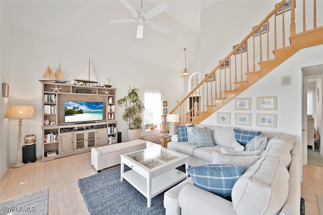 862 Beach Road Sanibel, FL 33957 - Photo 8 of 49 a living room with furniture and a flat screen tv