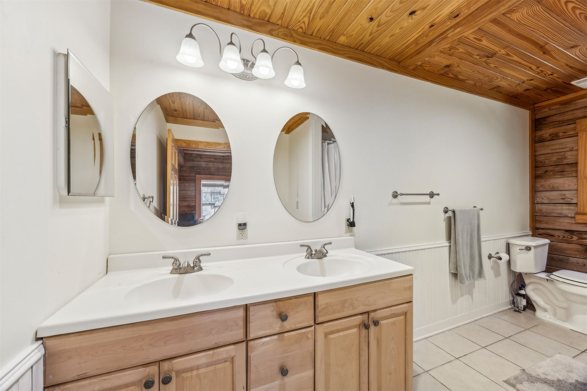 86205 Pages Dairy Road Yulee, FL 32097 - Photo 22 of 56 a bathroom with a double vanity sink and a mirror