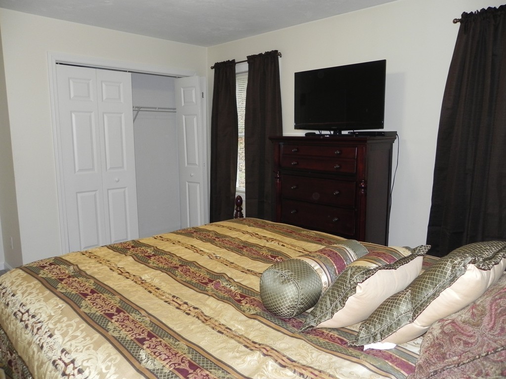 88 Brooks Road Athol, MA 01331 - Photo 18 of 30 a bedroom with a bed and a flat screen tv