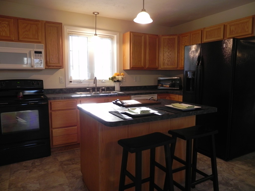 88 Brooks Road Athol, MA 01331 - Photo 3 of 30 a kitchen with a sink a stove a refrigerator and cabinetry