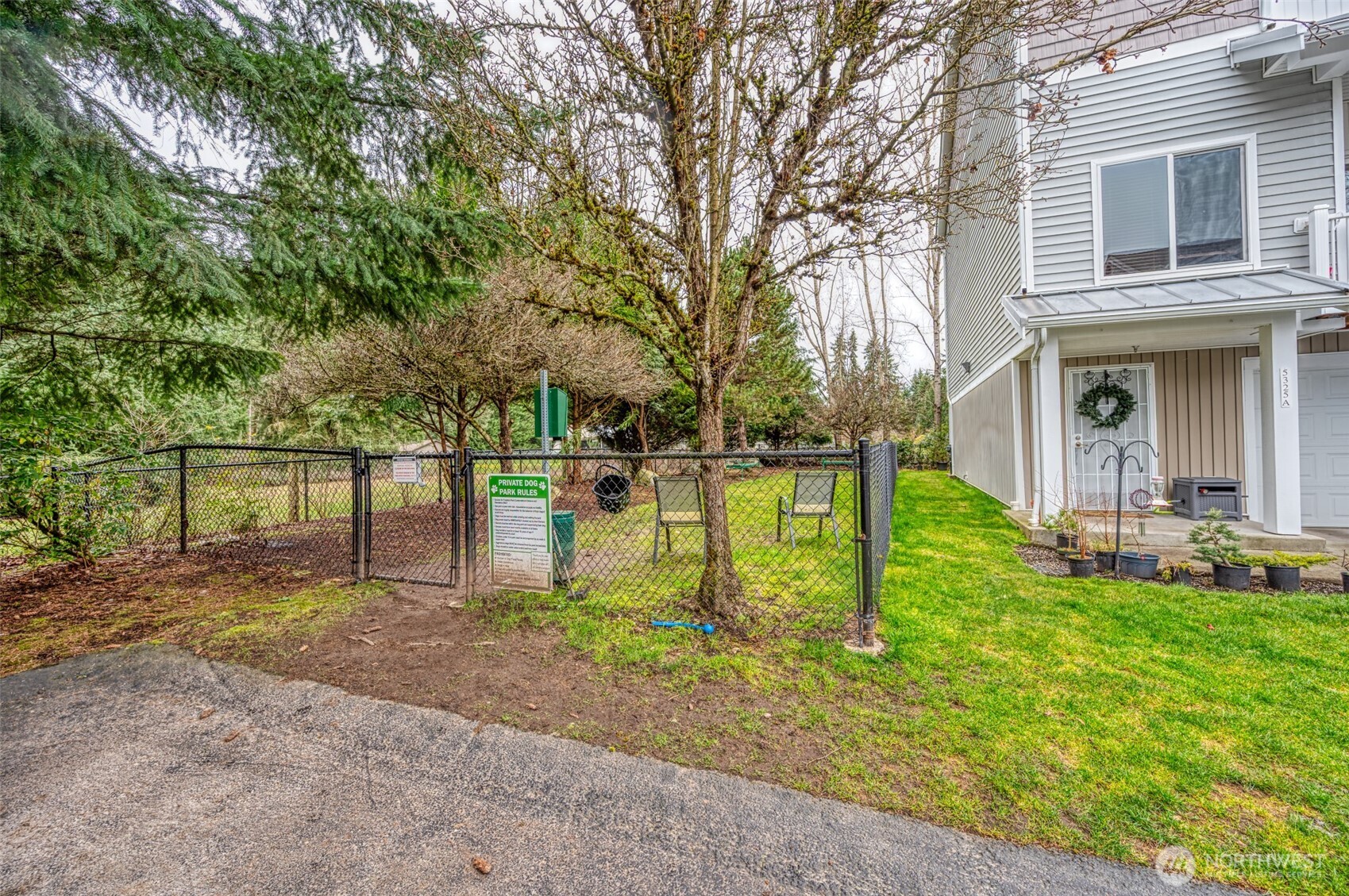 5325 Military Road East, Unit B Tacoma, WA 98446 - Photo 24 of 27 a backyard of a house with table and chairs