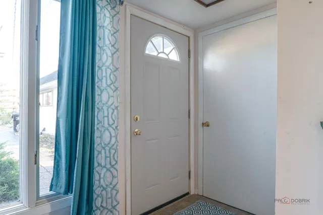 a view of empty room with windows