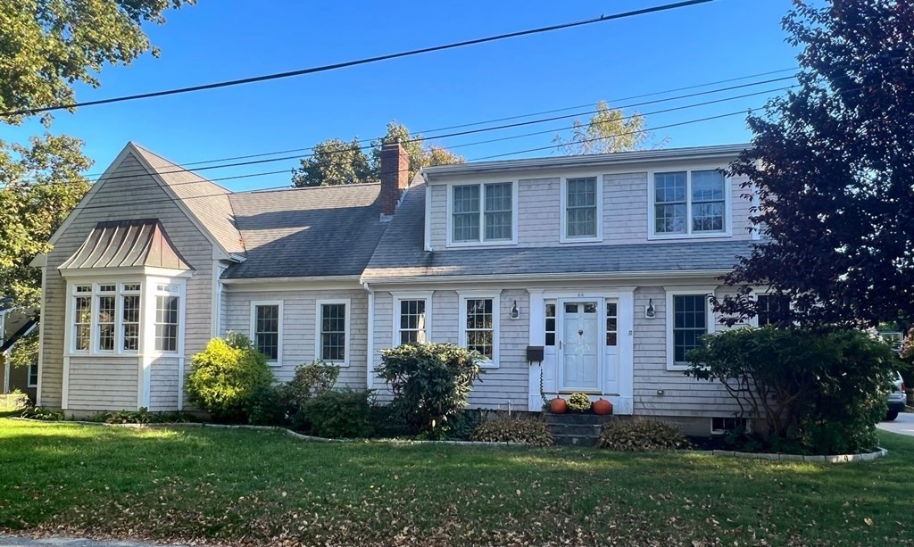 44 James Lane Cohasset, MA 02025 - Photo 1 of 25 a front view of a house with a garden