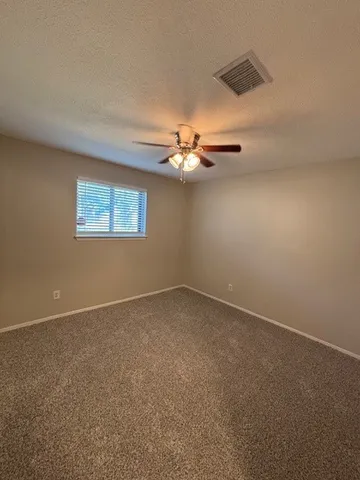 a kitchen with granite countertop a sink and steel appliances