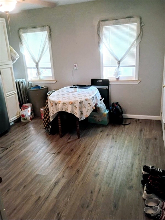 51 View Street Holyoke, MA 01040 - Photo 3 of 16 a bedroom with a bed and wooden floor