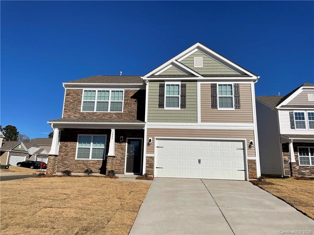 5005 Traynor Road, Unit 18 Charlotte, NC 28216 - Photo 2 of 35 a front view of a house with a yard