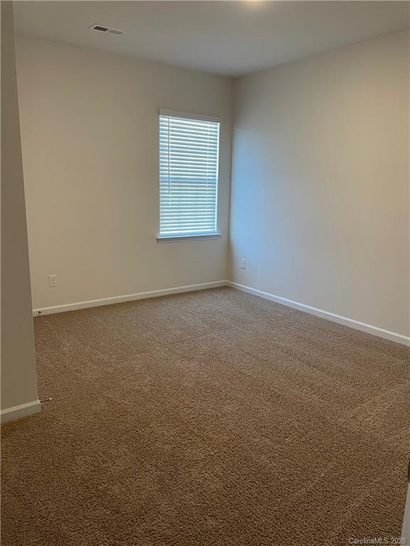 5005 Traynor Road, Unit 18 Charlotte, NC 28216 - Photo 16 of 35 an empty room with windows