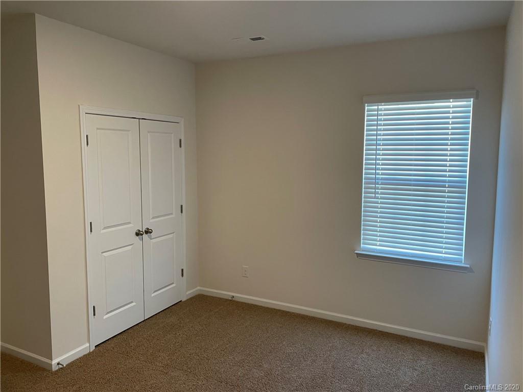 5005 Traynor Road, Unit 18 Charlotte, NC 28216 - Photo 17 of 35 an empty room with a window