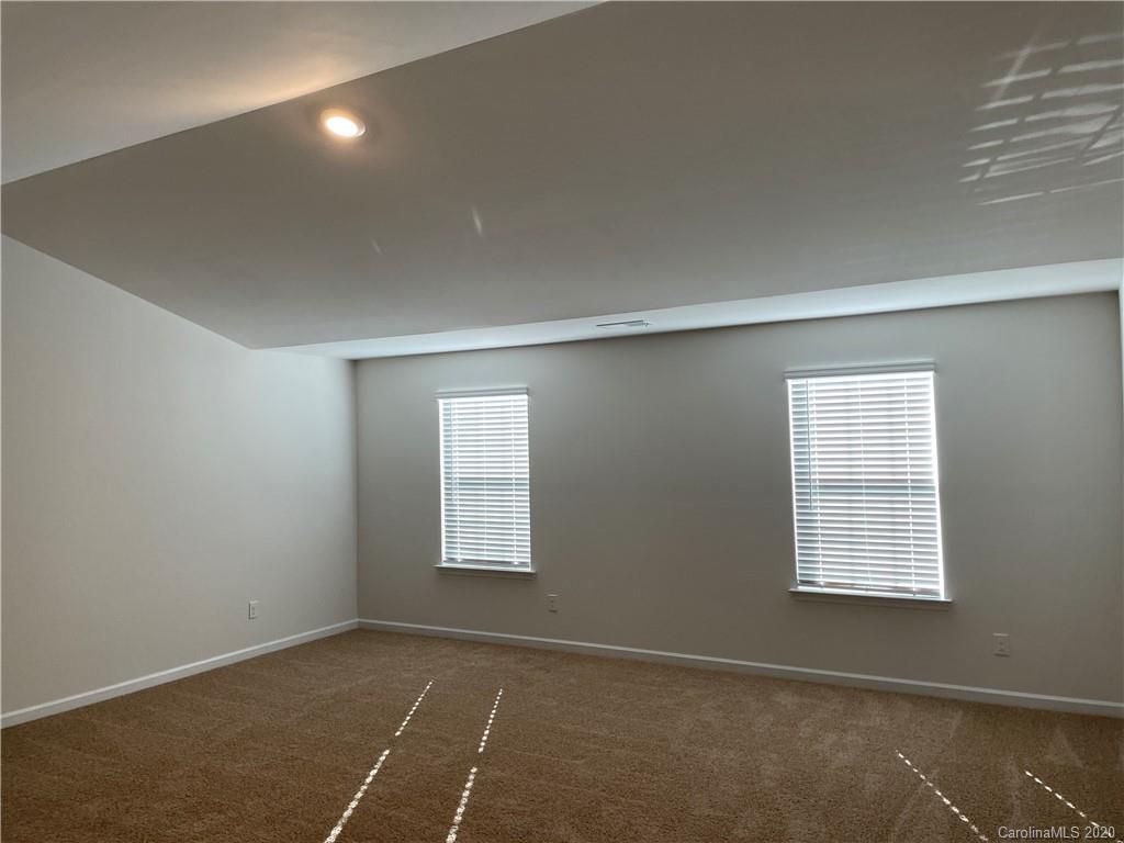 5005 Traynor Road, Unit 18 Charlotte, NC 28216 - Photo 19 of 35 an empty room with windows
