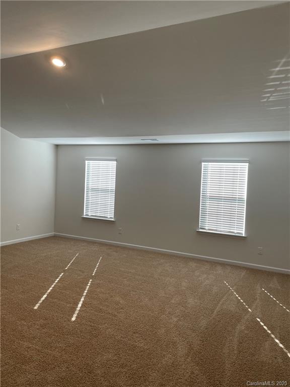 5005 Traynor Road, Unit 18 Charlotte, NC 28216 - Photo 20 of 35 an empty room with windows