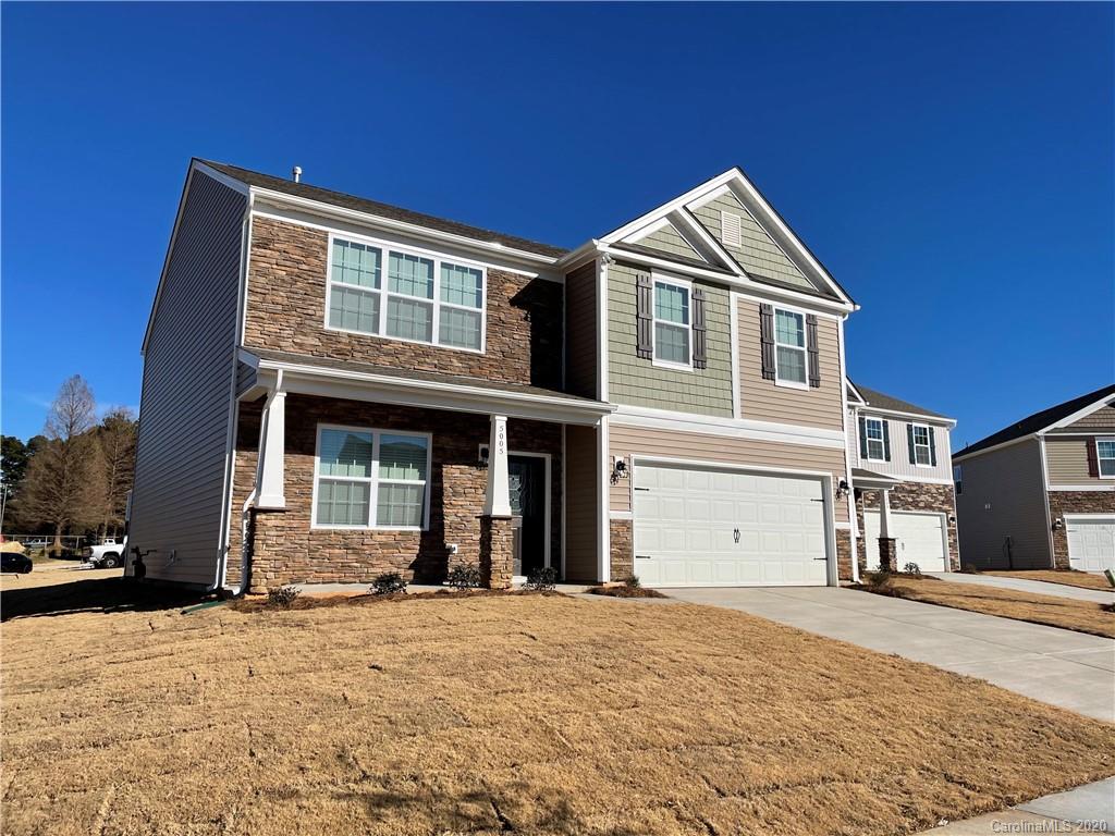 5005 Traynor Road, Unit 18 Charlotte, NC 28216 - Photo 3 of 35 a view of a house with a yard
